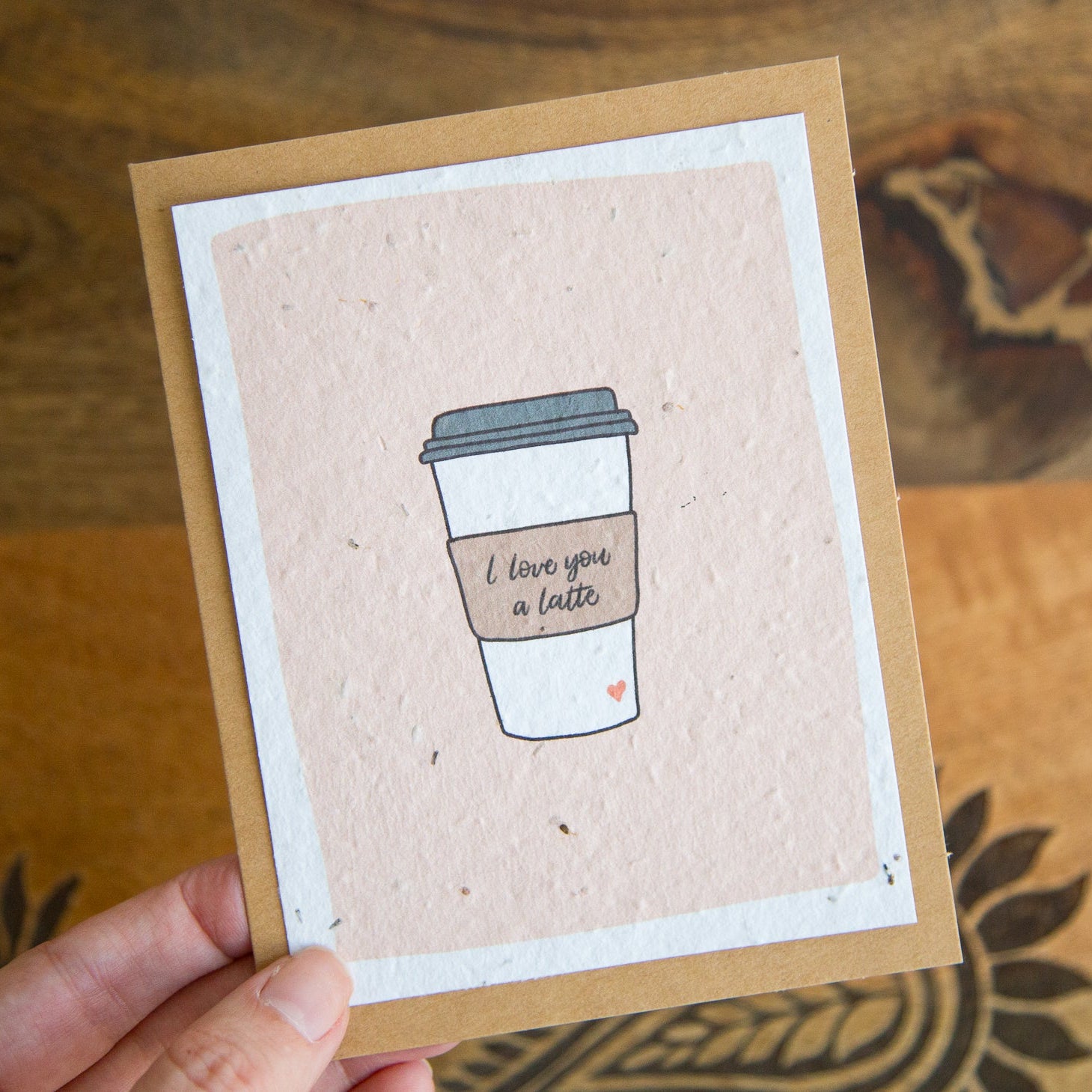 Card with a coffee cup illustration and 'I love you a latte' text