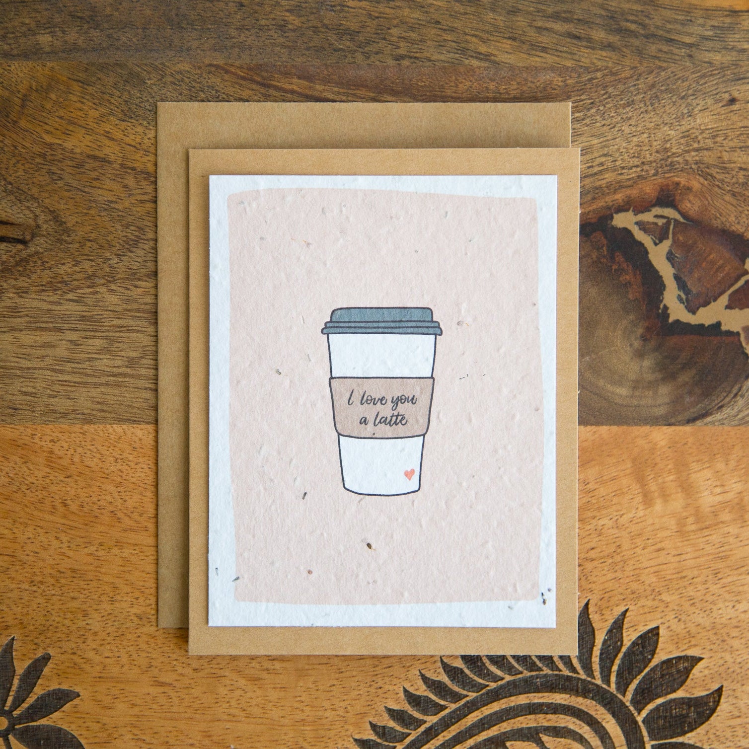 Greeting card with a coffee cup illustration with the words "I love you a latte"