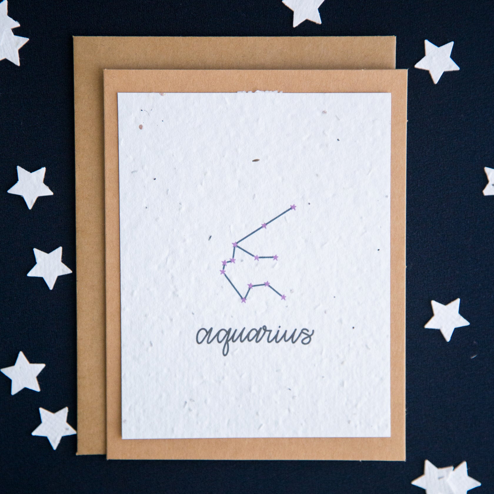 A greeting card with the Aquarius constellation and word “Aquarius” printed on plantable seed paper