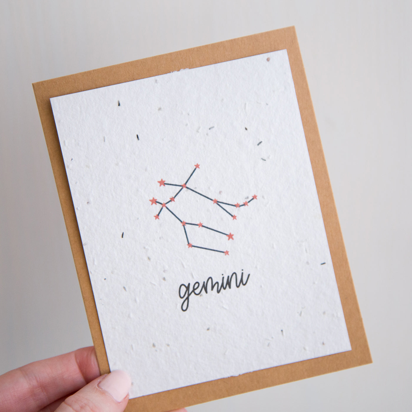 A greeting card with the Gemini constellation and word “Gemini” printed on plantable seed paper