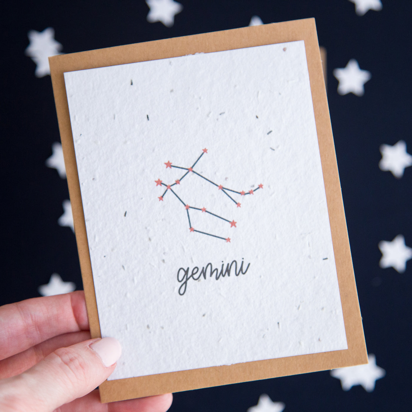 A greeting card with the Gemini constellation and word “Gemini” printed on plantable seed paper