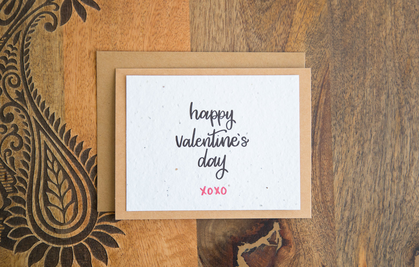 Plantable greeting card with the words "happy Valentine's Day xoxo" printed in black on white paper