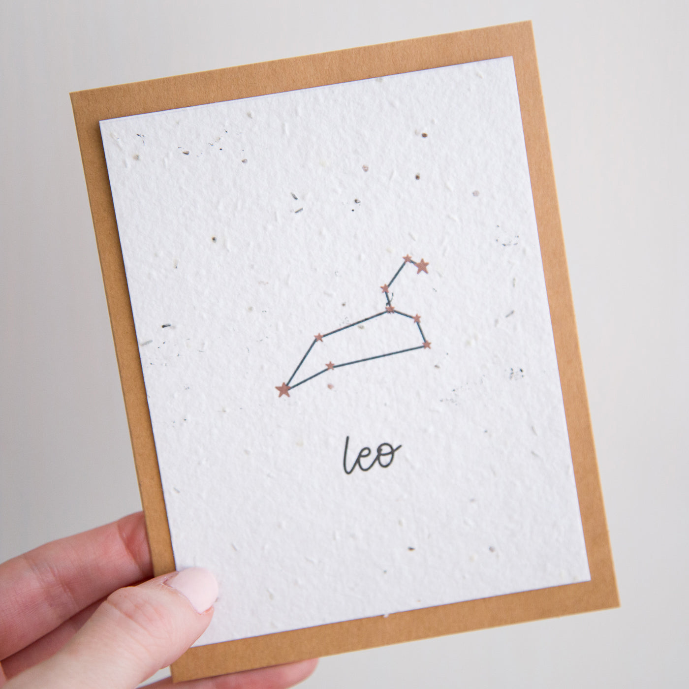 A greeting card with the Leo constellation and word “Leo” printed on plantable seed paper