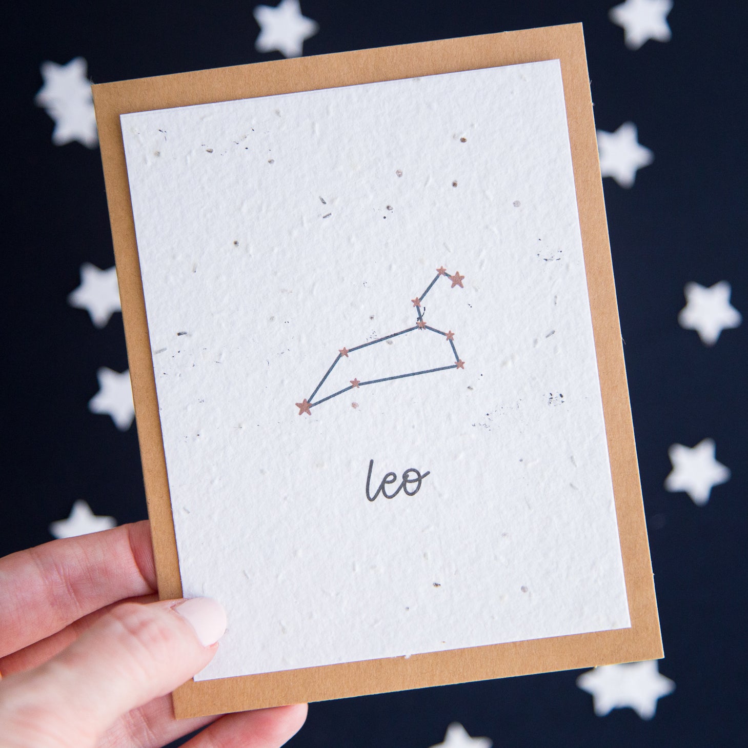 A greeting card with the Leo constellation and word “Leo” printed on plantable seed paper