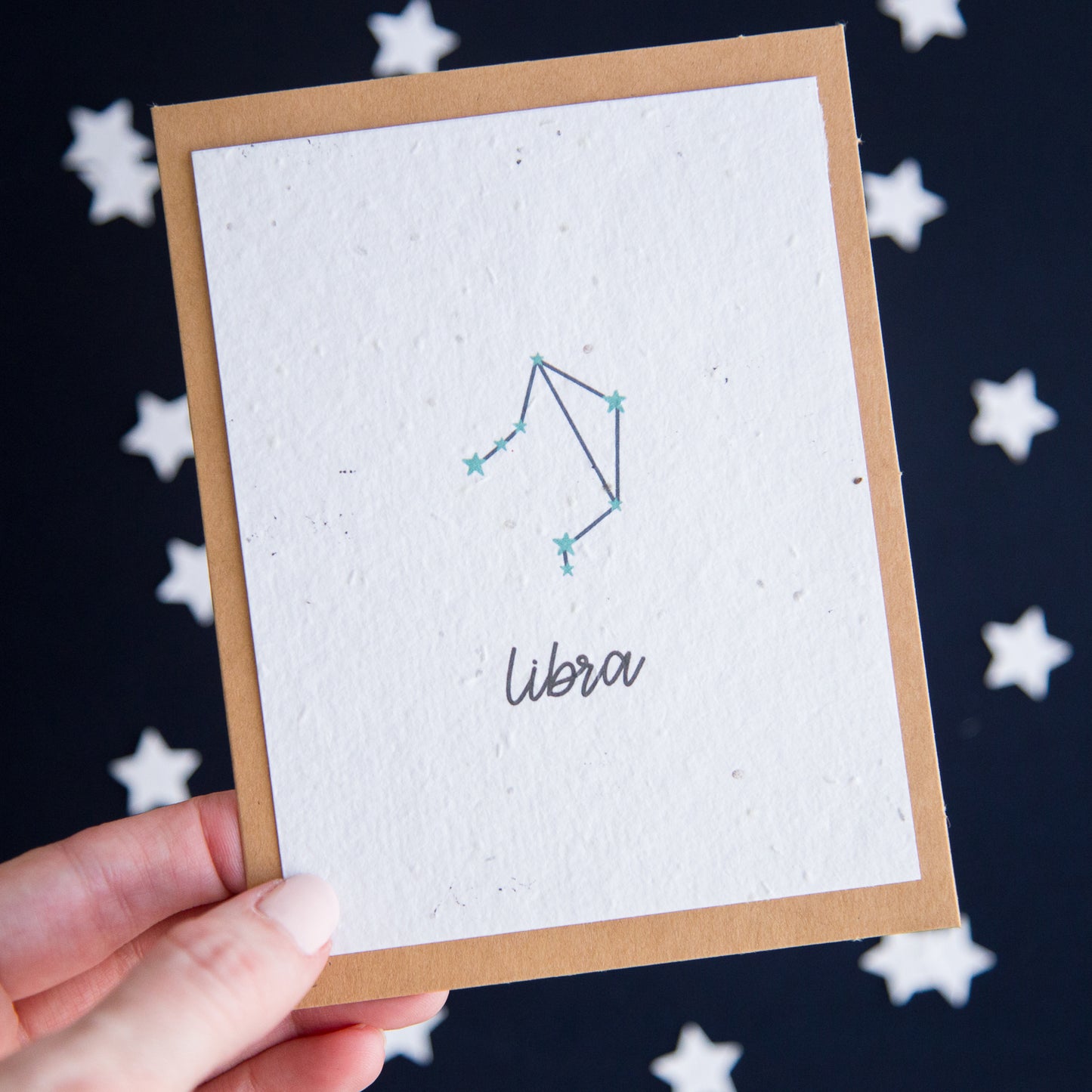 A greeting card with the Libra constellation and word “Libra” printed on plantable seed paper