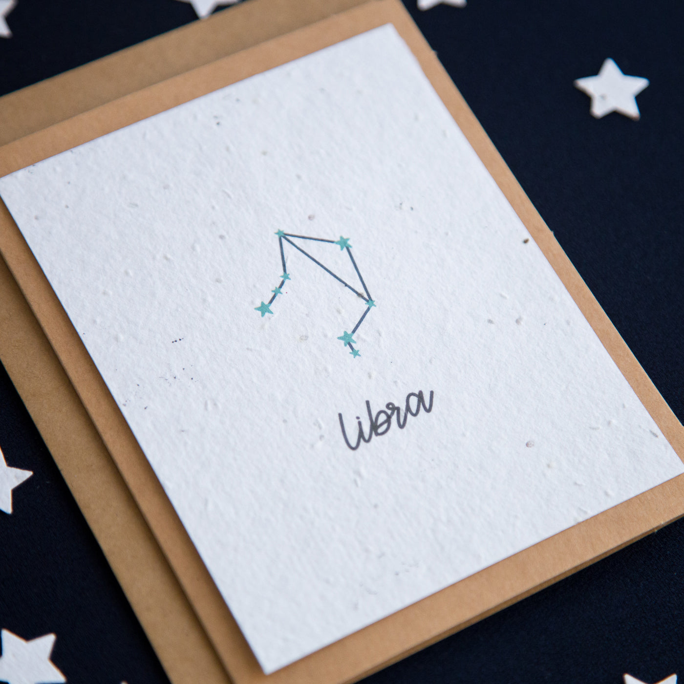 A greeting card with the Libra constellation and word “Libra” printed on plantable seed paper