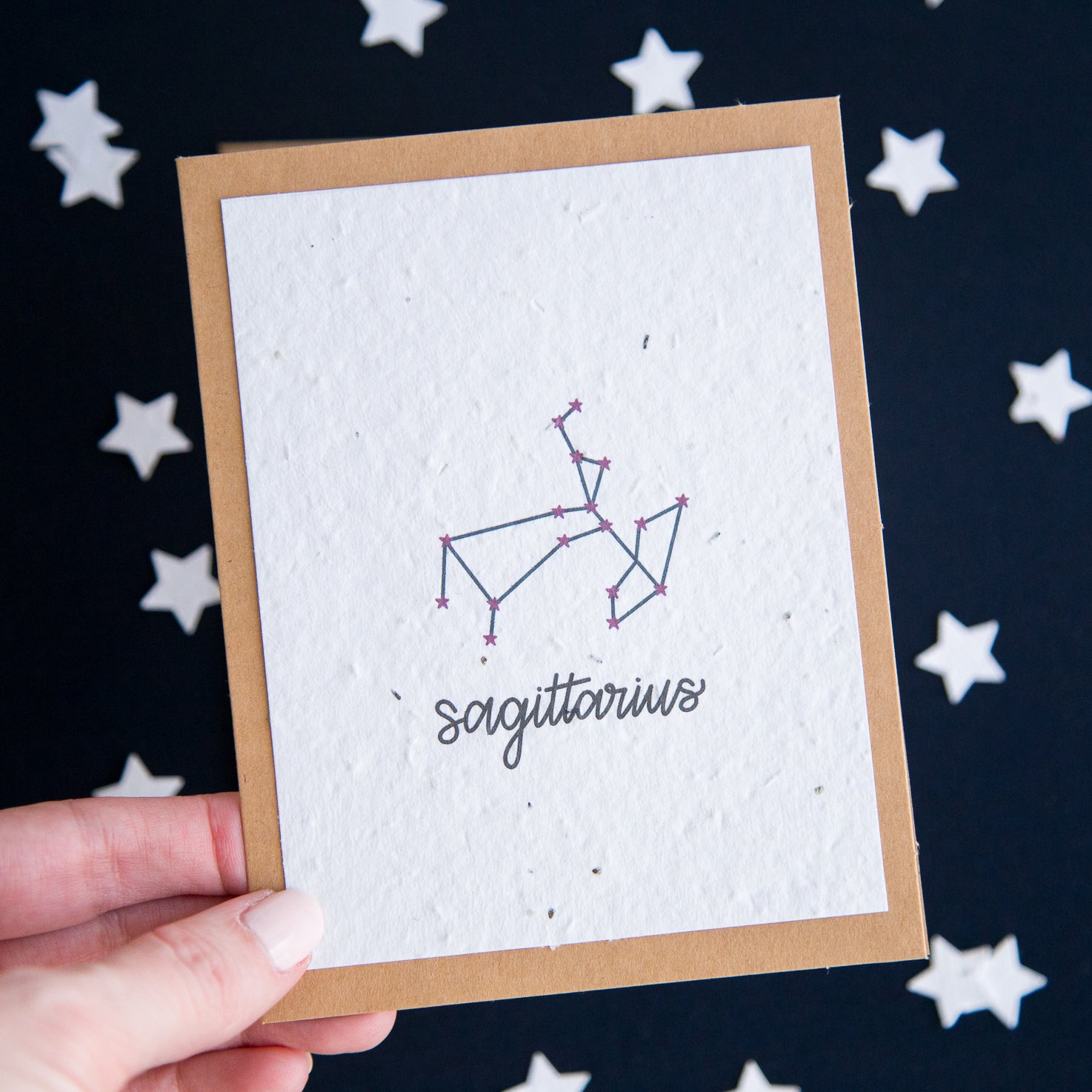 A greeting card with the Sagittarius constellation and word “Sagittarius” printed on plantable seed paper