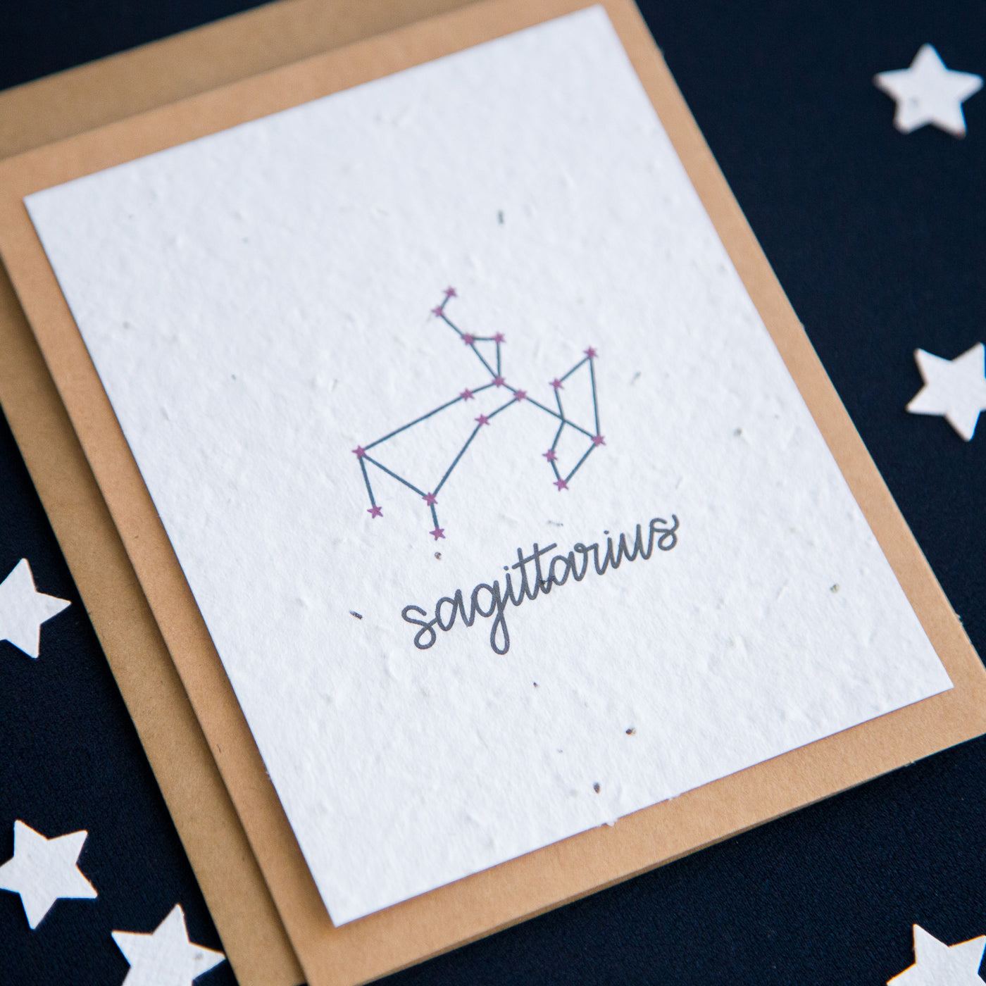 A greeting card with the Sagittarius constellation and word “Sagittarius” printed on plantable seed paper