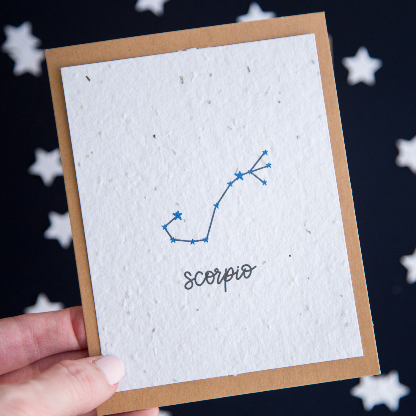 A greeting card with the Scorpio constellation and word “Scorpio” printed on plantable seed paper