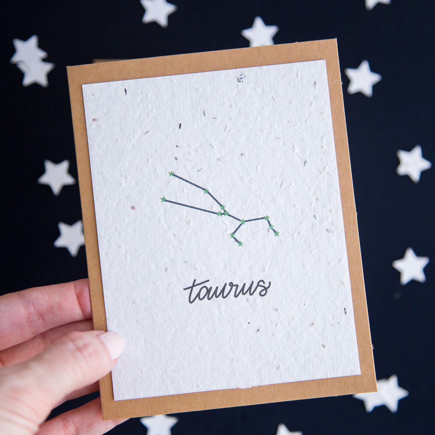 A greeting card with the Taurus constellation and word “Taurus” printed on plantable seed paper