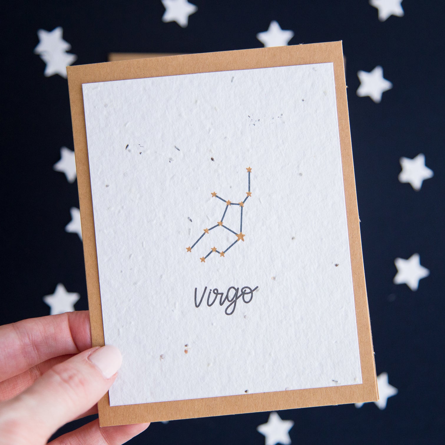 A greeting card with the Virgo constellation and word “Virgo” printed on plantable seed paper