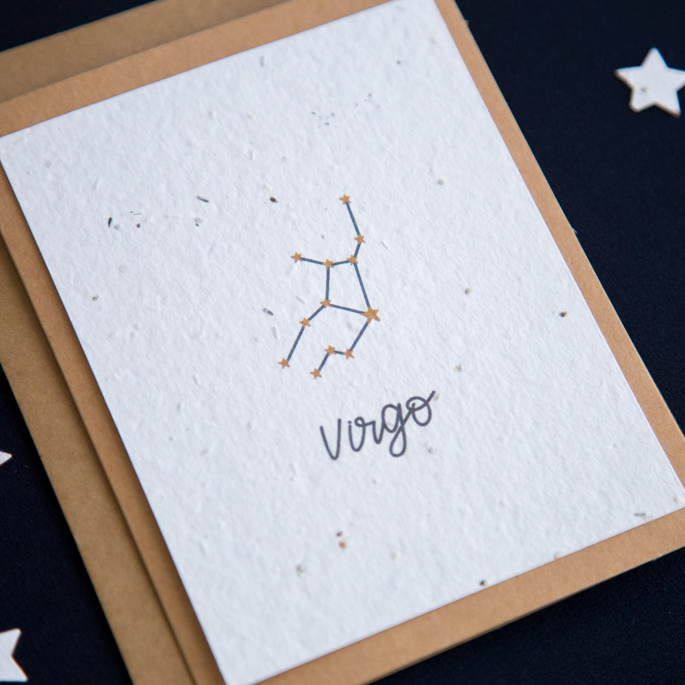 A greeting card with the Virgo constellation and word “Virgo” printed on plantable seed paper