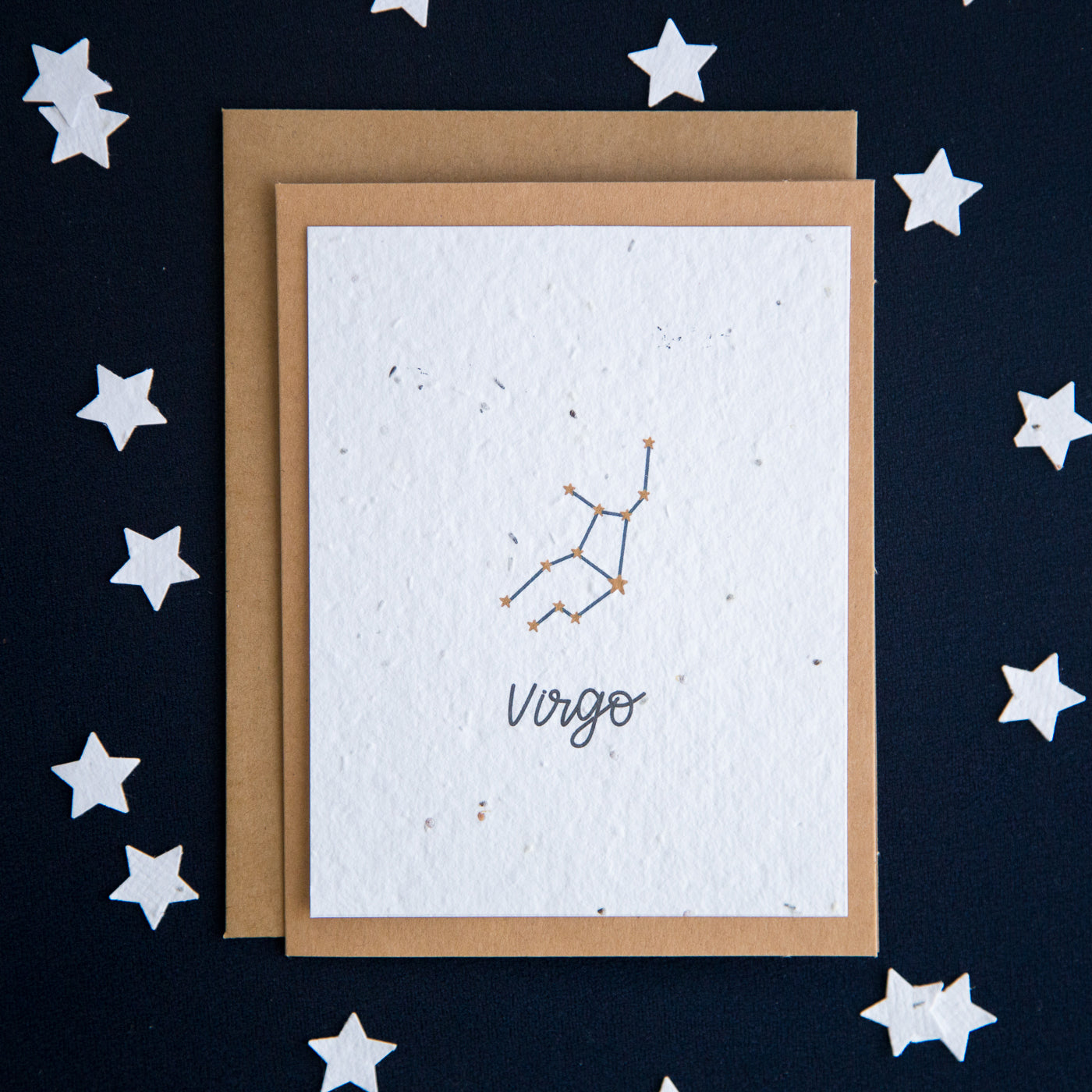 A greeting card with the Virgo constellation and word “Virgo” printed on plantable seed paper