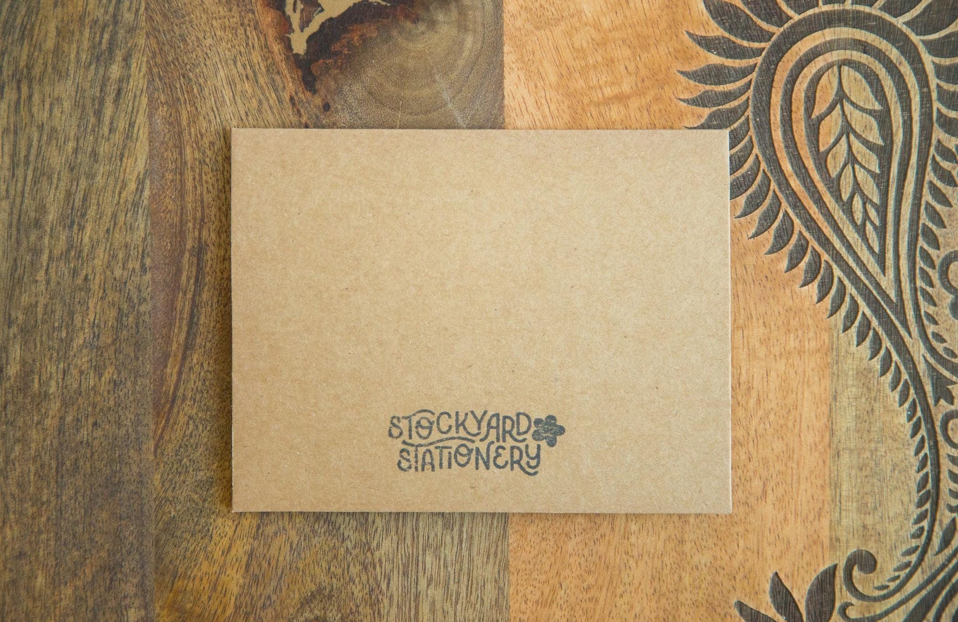 Back of a greeting card with the logo Stockyard Stationery stamped on
