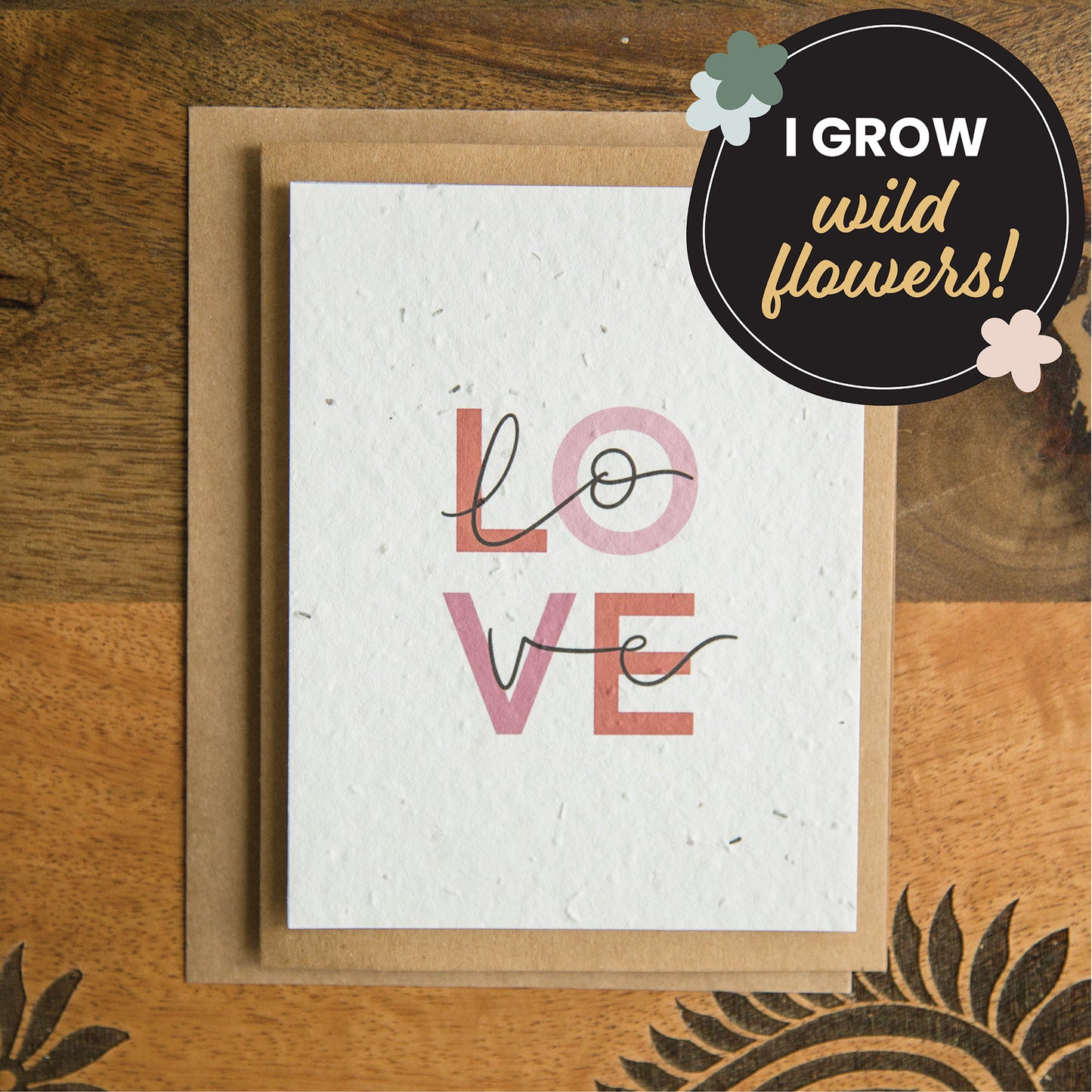 plantable greeting card with block letters spelling LOVE and calligraphy letters spelling love overtop