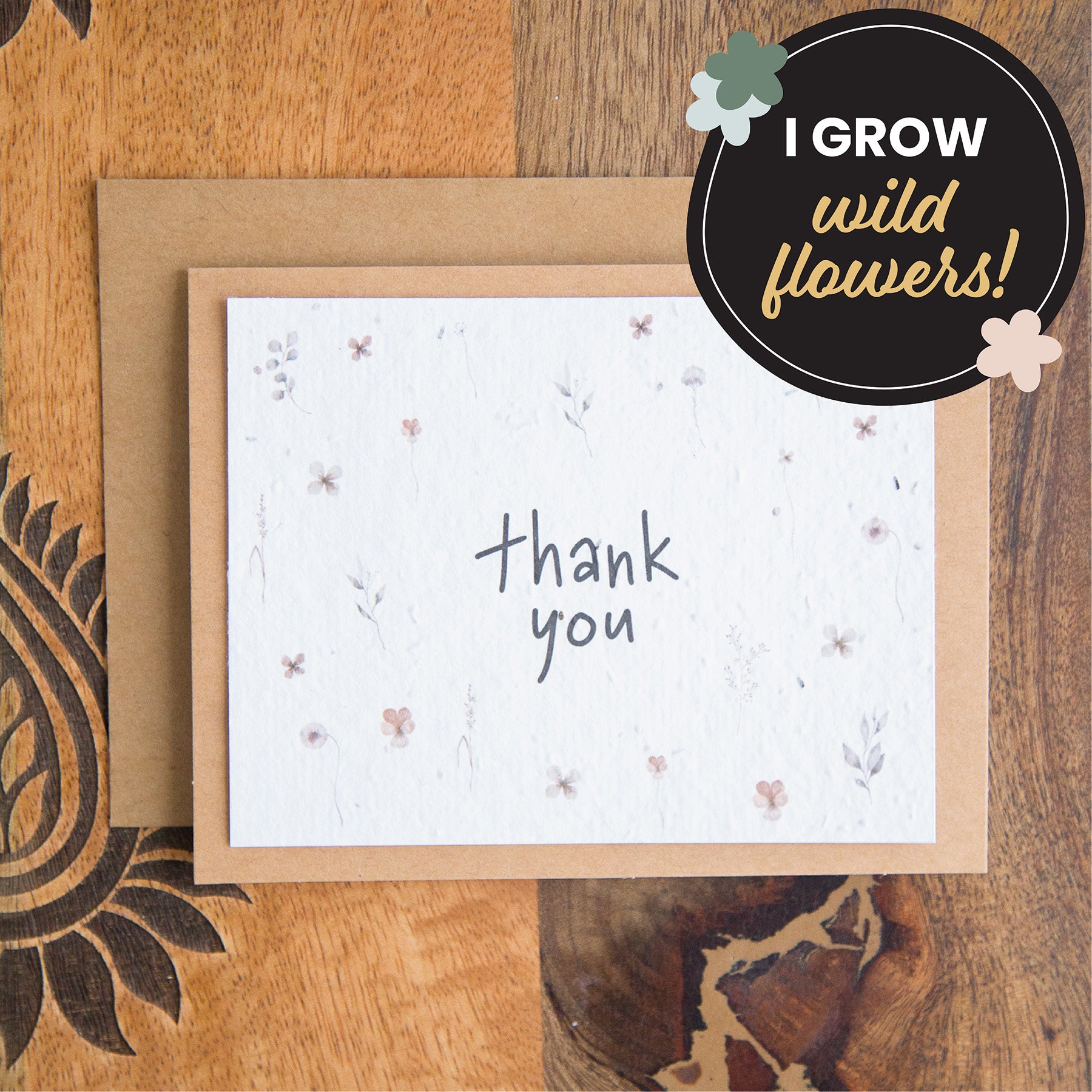 plantable thank you card with the words thank you surrounded by individual watercolour florals