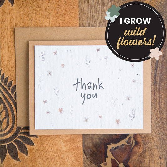 plantable thank you card with the words thank you surrounded by individual watercolour florals